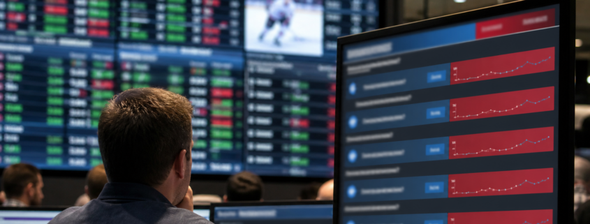 Unbranded comparison of prediction-market contracts and regulated sportsbook markets