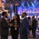 Editorial illustration of a G2E gaming event, industry networking, and a Las Vegas expo hall